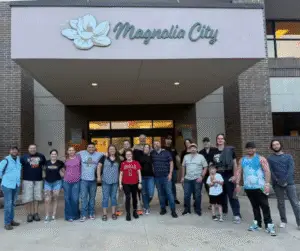 Mag city team photo outside entrance