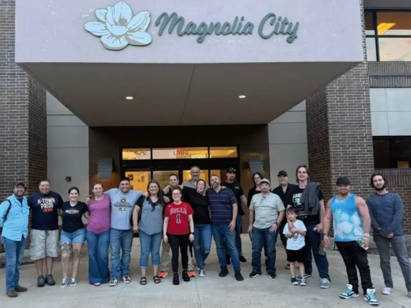 Mag city team photo outside entrance